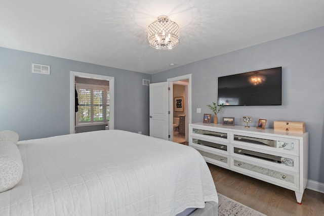 1137 Griffith Rd, Lake Forest, IL 60045 - bedroom with a chandelier, dark wood-style floors, and baseboards