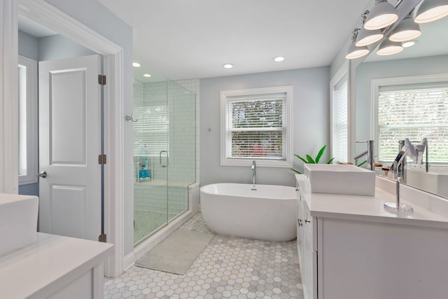 1137 Griffith Rd, Lake Forest, IL 60045 - bathroom featuring a shower stall, vanity, a freestanding bath, recessed lighting, and tile patterned flooring