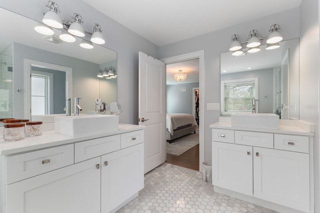 1137 Griffith Rd, Lake Forest, IL 60045 - bathroom with connected bathroom, an enclosed shower, two vanities, and tile patterned flooring