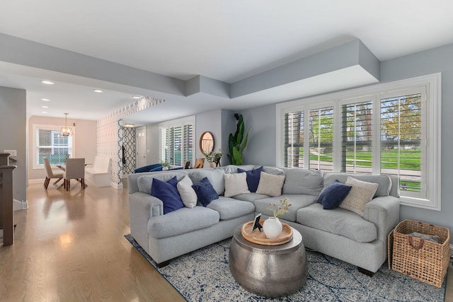 1137 Griffith Rd, Lake Forest, IL 60045 - living room featuring wood finished floors, healthy amount of natural light, a chandelier, recessed lighting, and baseboards