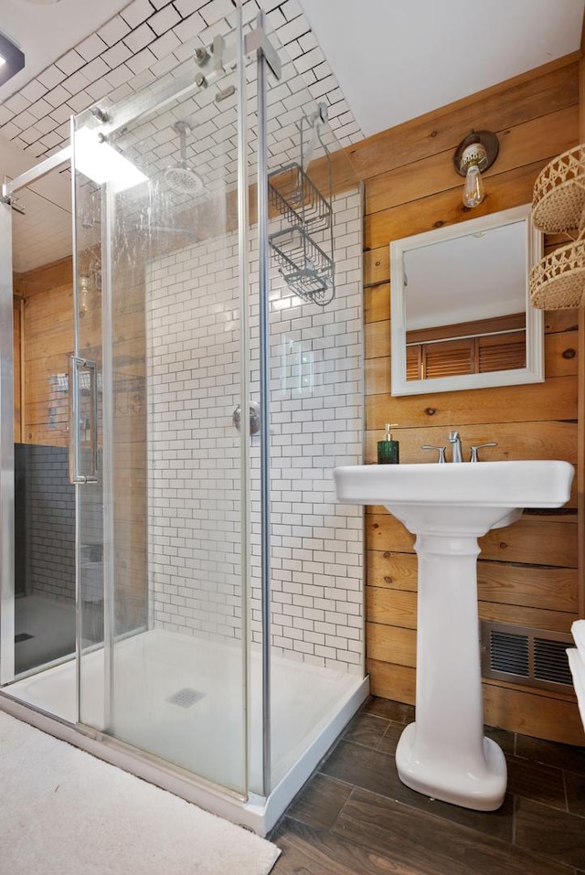 13459 N Tower Rd N, Lee, IL 60530 - bathroom with a shower stall and wooden walls