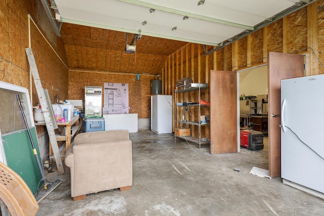13459 N Tower Rd N, Lee, IL 60530 - garage featuring freestanding refrigerator and a garage door opener