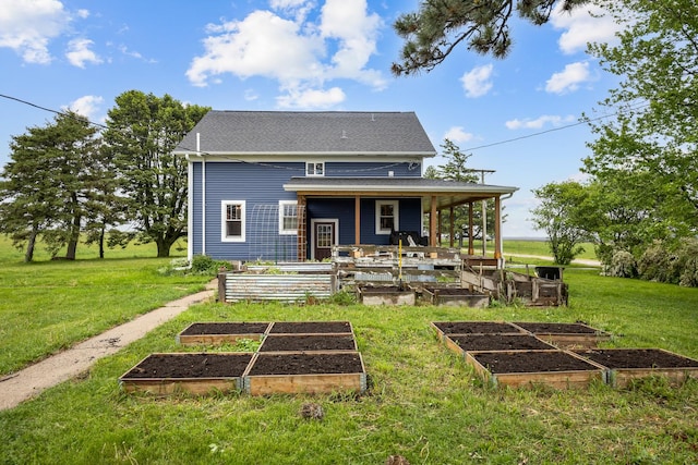 13459 N Tower Rd N, Lee, IL 60530 - rear view of property with a vegetable garden and a yard