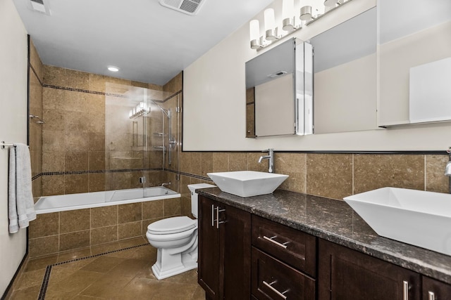 324 N Jefferson St Unit 101, Chicago, IL 60661 - full bathroom with tiled shower / bath combo, tile patterned floors, visible vents, and a sink
