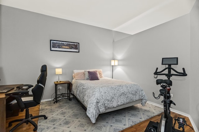 324 N Jefferson St Unit 101, Chicago, IL 60661 - bedroom featuring baseboards and wood finished floors