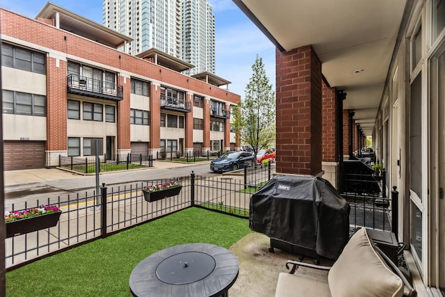 324 N Jefferson St Unit 101, Chicago, IL 60661 - view of patio featuring area for grilling and fence