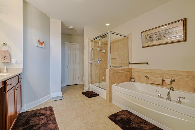 bathroom with a shower stall, vanity, a bath, tile patterned floors, and toilet