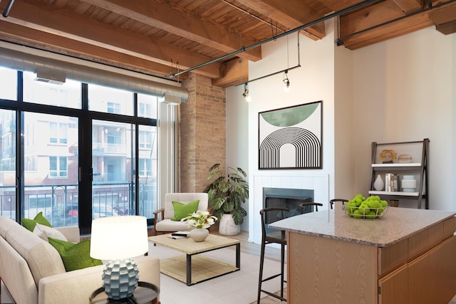 1250 W Van Buren St Unit 203, Chicago, IL 60607 - living area with a fireplace and wooden ceiling with exposed beams