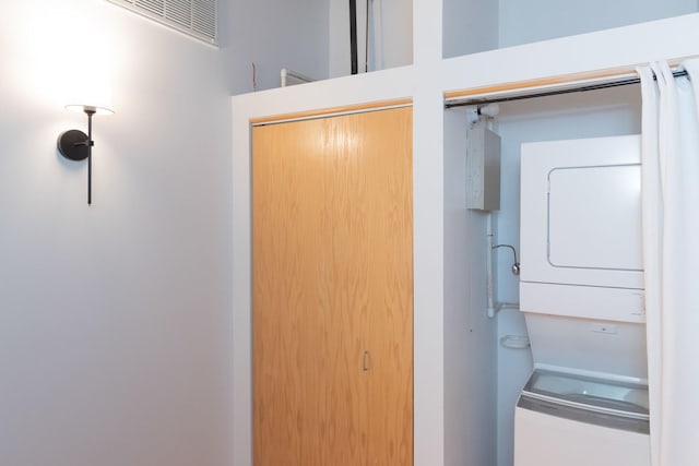 1250 W Van Buren St Unit 203, Chicago, IL 60607 - washroom featuring estacked washer and dryer