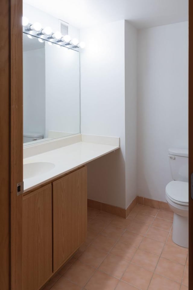 1250 W Van Buren St Unit 203, Chicago, IL 60607 - half bathroom with toilet, vanity, and tile patterned floors