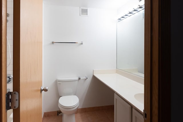 1250 W Van Buren St Unit 202, Chicago, IL 60607 - bathroom featuring toilet, vanity, tile patterned floors, and baseboards