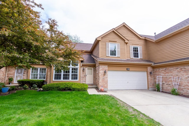 534 Philip Dr, Bartlett, IL 60103 - traditional-style home featuring a garage, driveway, brick siding, a front yard, and a shingled roof