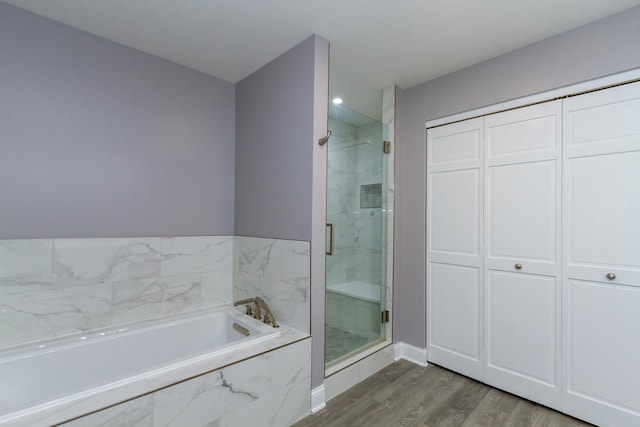 534 Philip Dr, Bartlett, IL 60103 - full bathroom with a shower stall, wood finished floors, a garden tub, baseboards, and recessed lighting