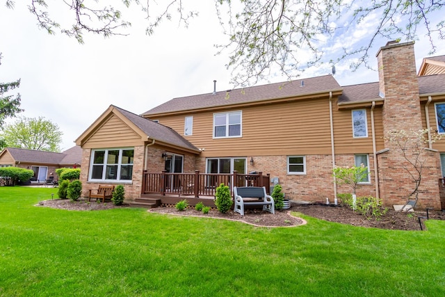 534 Philip Dr, Bartlett, IL 60103 - back of house featuring brick siding, a wooden deck, a yard, and a chimney