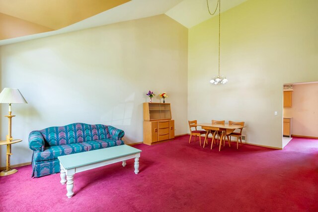 534 Philip Dr, Bartlett, IL 60103 - living area featuring carpet floors, high vaulted ceiling, a chandelier, and baseboards