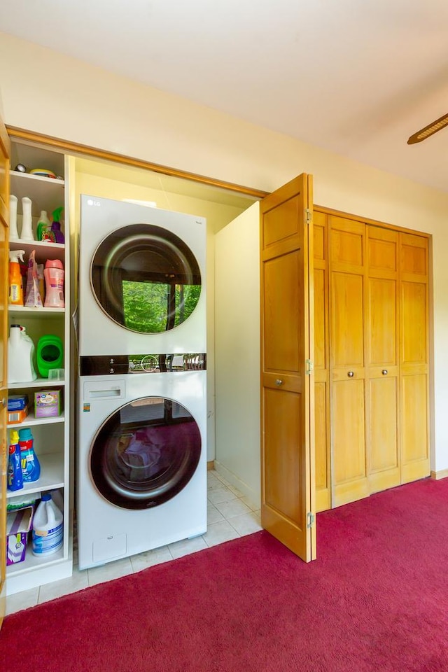 534 Philip Dr, Bartlett, IL 60103 - clothes washing area with stacked washer / drying machine, light tile patterned floors, a ceiling fan, and light colored carpet