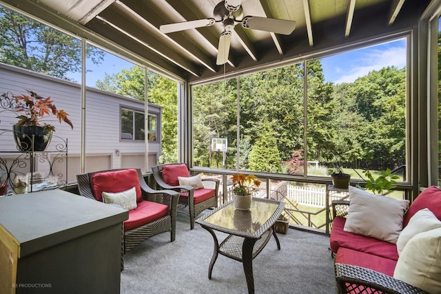 sunroom featuring ceiling fan and an outdoor hangout area