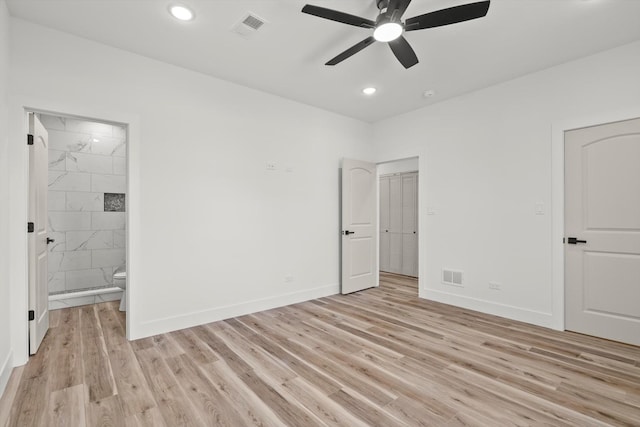 unfurnished bedroom featuring visible vents, light wood-style floors, and baseboards