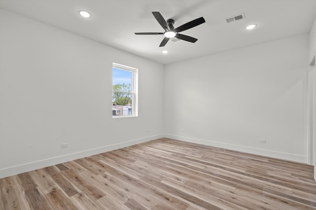 unfurnished room featuring baseboards, ceiling fan, and visible vents