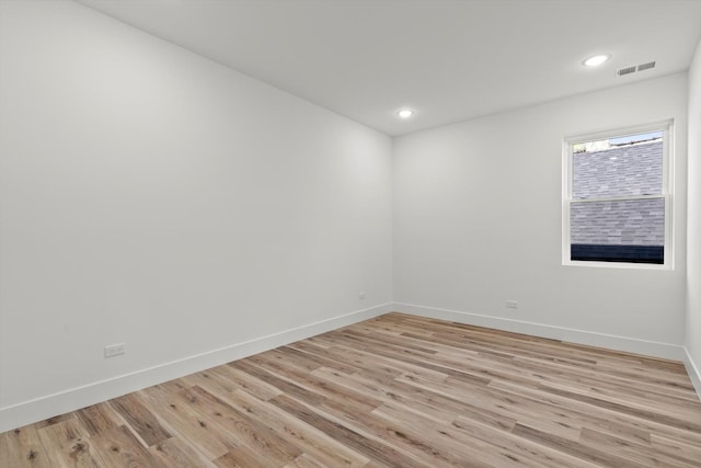 spare room with recessed lighting, baseboards, visible vents, and light wood-style flooring