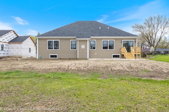 back of property featuring a lawn