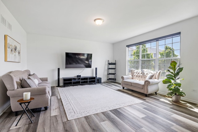 living room with wood finished floors and baseboards
