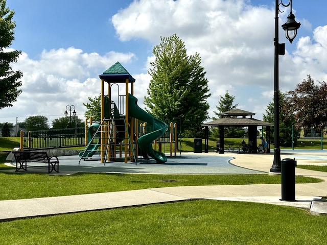 communal playground with a yard and a gazebo