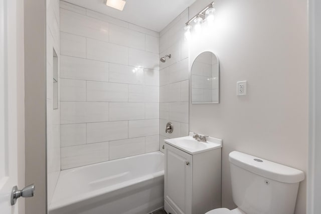 full bathroom featuring washtub / shower combination, toilet, and vanity