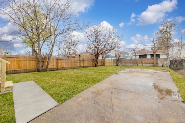 view of yard with a patio area and a fenced backyard