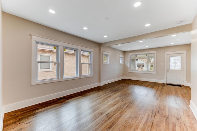 interior space with recessed lighting, light wood-style floors, and baseboards