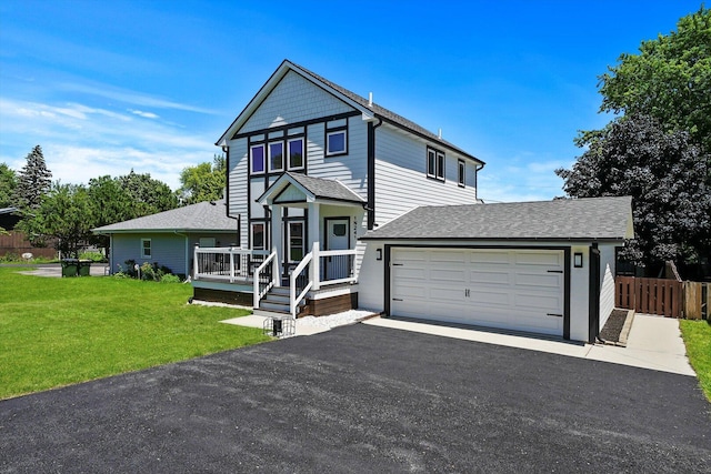 view of front facade featuring fence, driveway, a garage, a front lawn, and a shingled roof