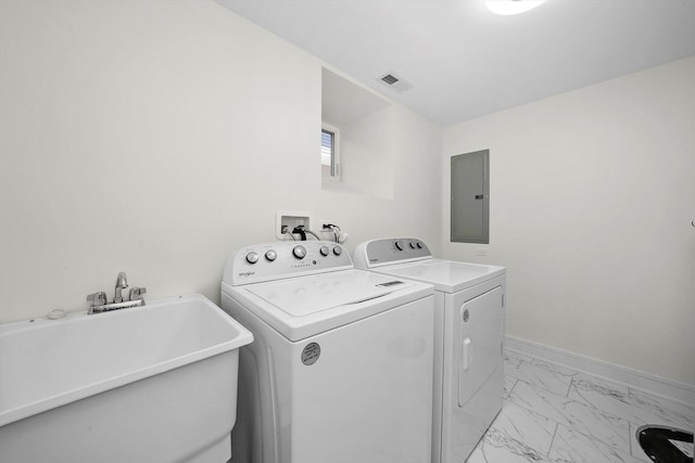 washroom with washer and dryer, a sink, laundry area, electric panel, and visible vents
