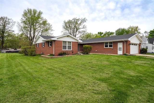1306 Ewing St, Bloomington, IL 61701 - ranch-style home with an attached garage, a front yard, driveway, and brick siding