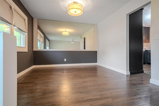 1306 Ewing St, Bloomington, IL 61701 - empty room with baseboards and dark wood finished floors