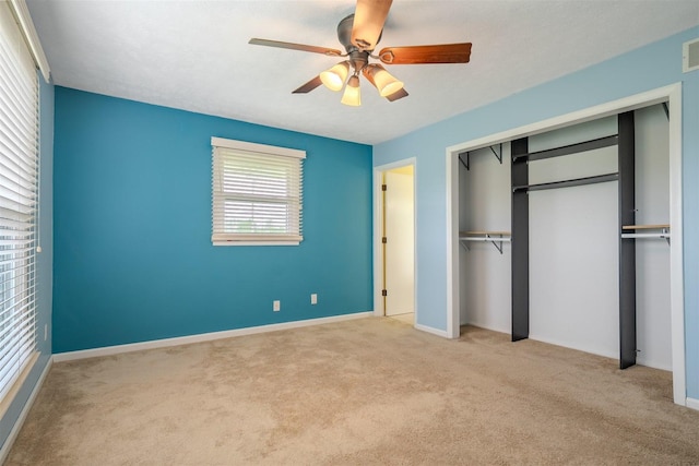 1306 Ewing St, Bloomington, IL 61701 - unfurnished bedroom featuring carpet floors, a ceiling fan, baseboards, and a closet