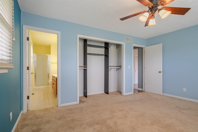 1306 Ewing St, Bloomington, IL 61701 - unfurnished bedroom with visible vents, a closet, light carpet, baseboards, and ensuite bath