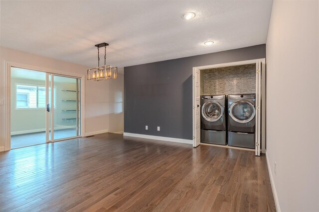 1306 Ewing St, Bloomington, IL 61701 - interior space featuring baseboards, washing machine and dryer, a chandelier, and dark wood-style floors