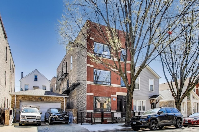 1811 W 17th St Unit 201, Chicago, IL 60608 - view of front of property featuring brick siding and an attached garage