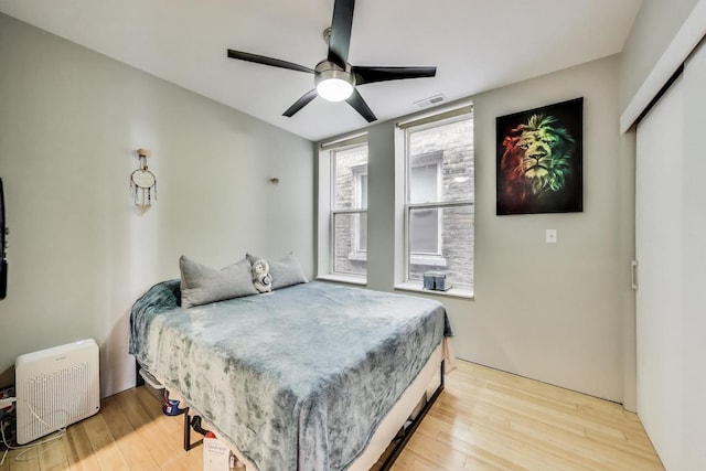 1811 W 17th St Unit 201, Chicago, IL 60608 - bedroom featuring a ceiling fan, visible vents, and light wood-style flooring