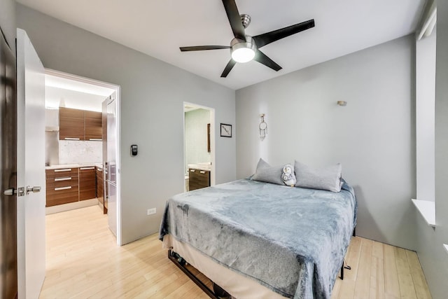 1811 W 17th St Unit 201, Chicago, IL 60608 - bedroom featuring a ceiling fan, ensuite bath, and light wood-style flooring