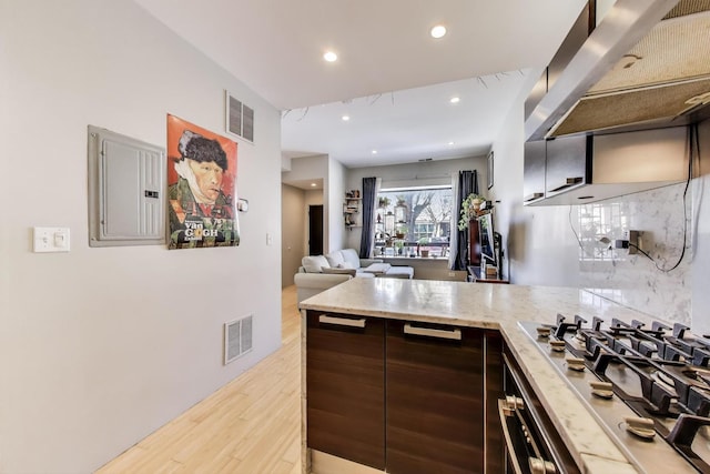 1811 W 17th St Unit 201, Chicago, IL 60608 - kitchen featuring electric panel, stainless steel appliances, light wood-type flooring, and visible vents