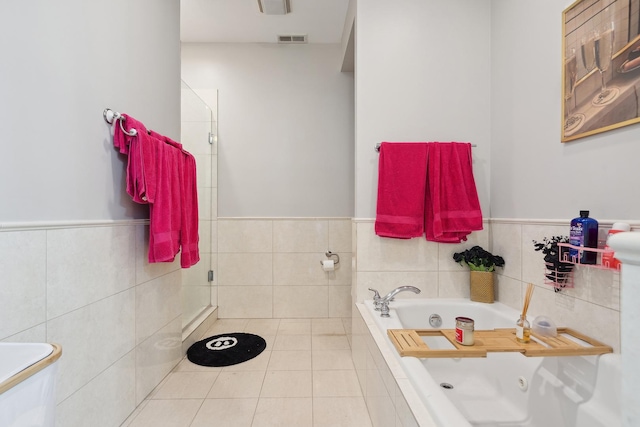 531 N Racine Ave Unit 3, Chicago, IL 60622 - full bathroom with a shower stall, a jetted tub, tile walls, a wainscoted wall, and tile patterned floors
