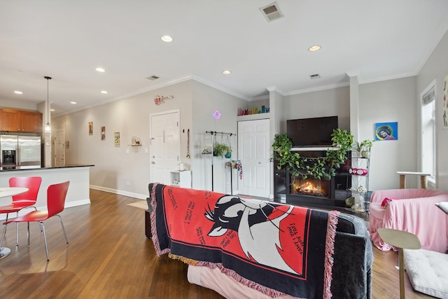 531 N Racine Ave Unit 3, Chicago, IL 60622 - living room with dark wood-type flooring, recessed lighting, baseboards, a glass covered fireplace, and ornamental molding