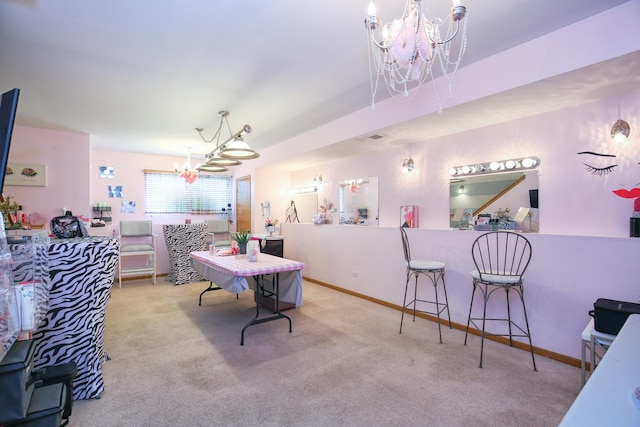 dining area featuring an inviting chandelier, carpet floors, and baseboards