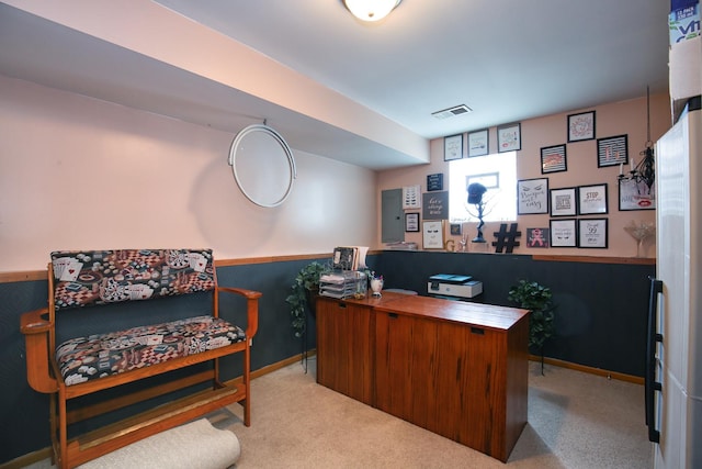 office area featuring visible vents, carpet floors, and baseboards