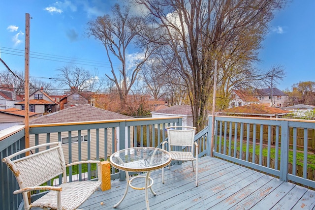 wooden deck featuring a residential view