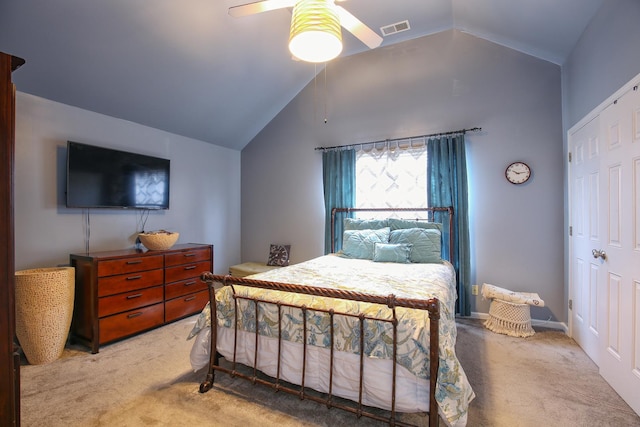 carpeted bedroom featuring visible vents, ceiling fan, and vaulted ceiling