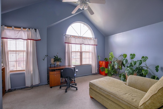 carpeted home office with ceiling fan and lofted ceiling