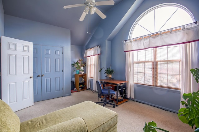 office space featuring lofted ceiling, a ceiling fan, and carpet flooring
