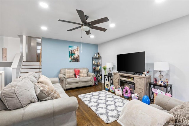 living room with stairs, a ceiling fan, recessed lighting, and dark wood-style floors